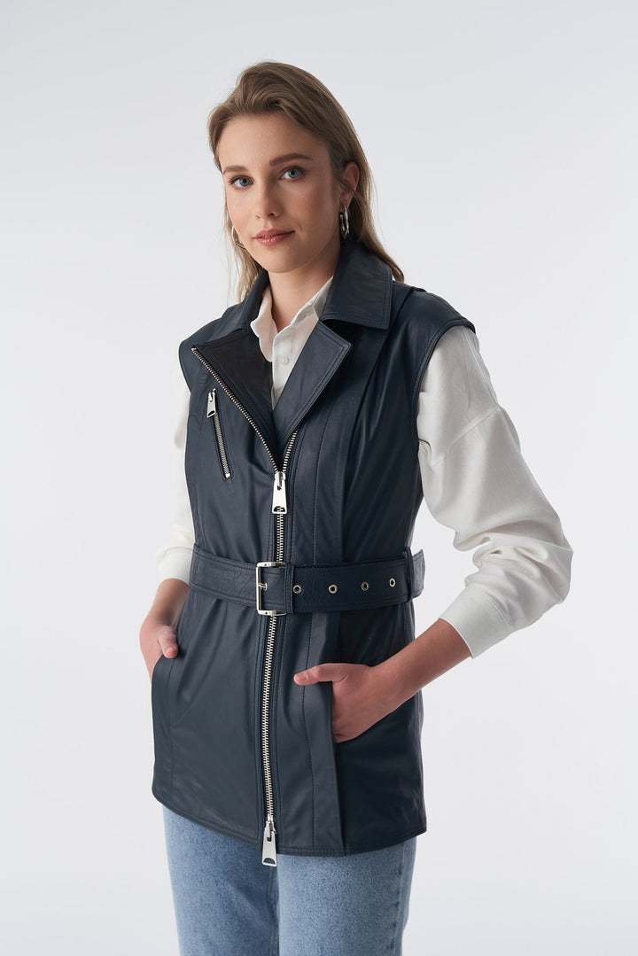 Woman wearing black belted leather vest