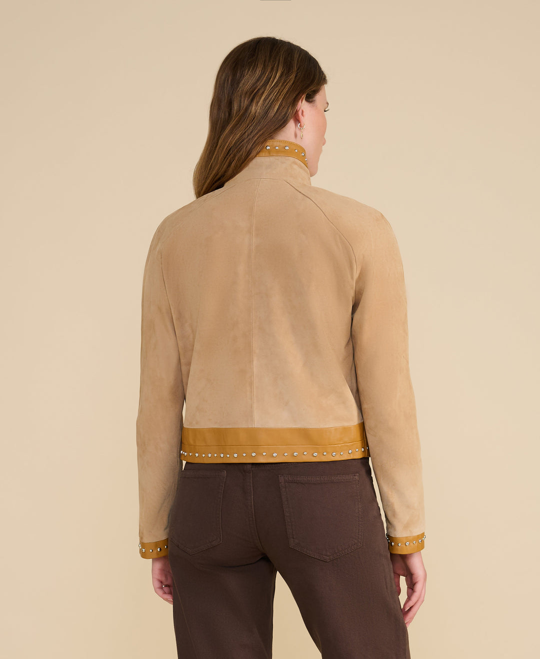 Back of beige suede studded jacket