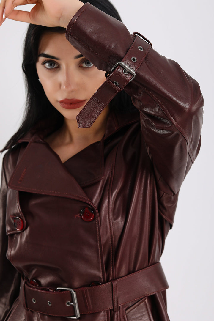 Woman wearing burgundy leather trench coat