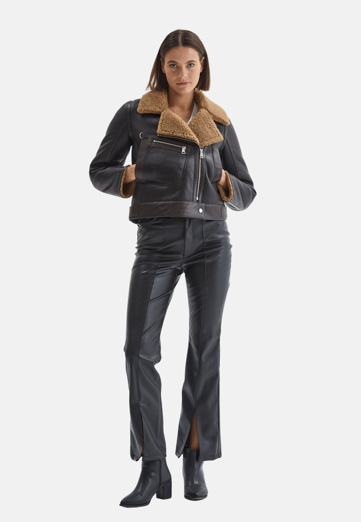 Woman wearing black shearling-lined jacket