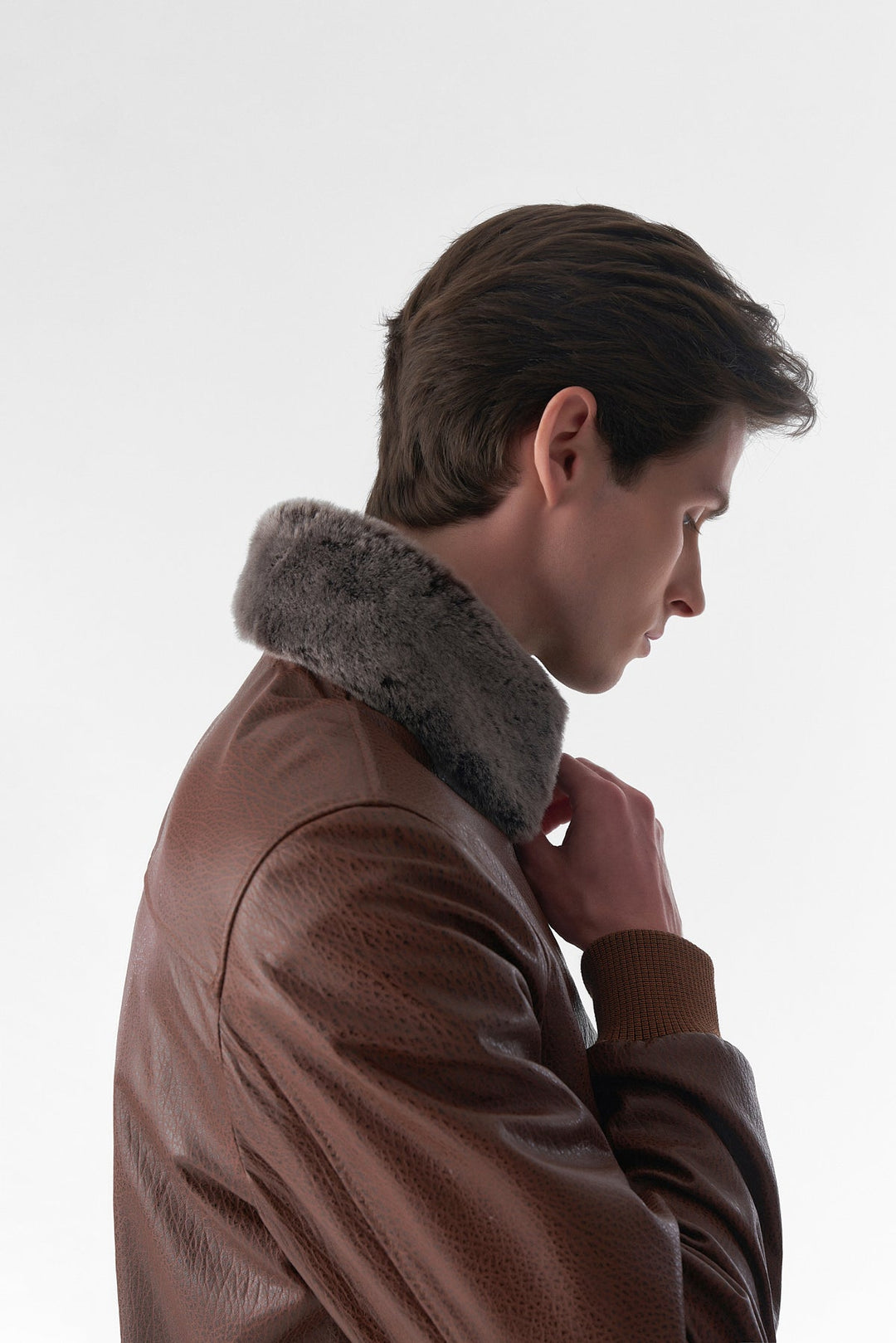 Male model wearing brown leather jacket