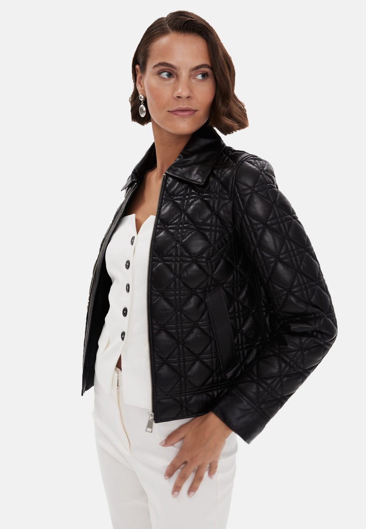 Woman wearing black quilted leather jacket