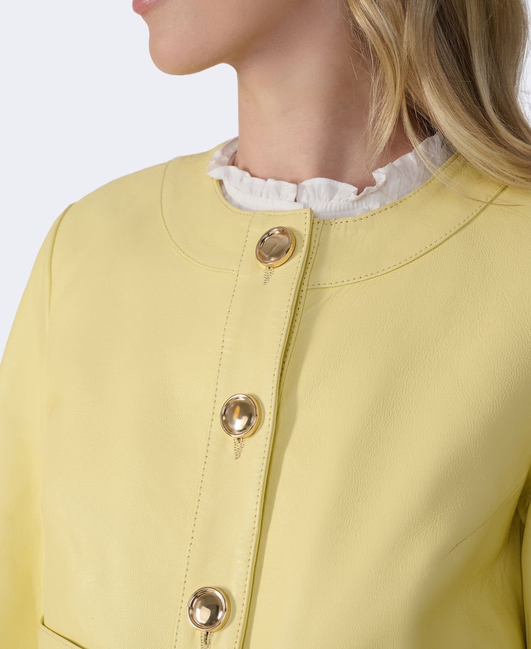 Yellow leather jacket with gold buttons