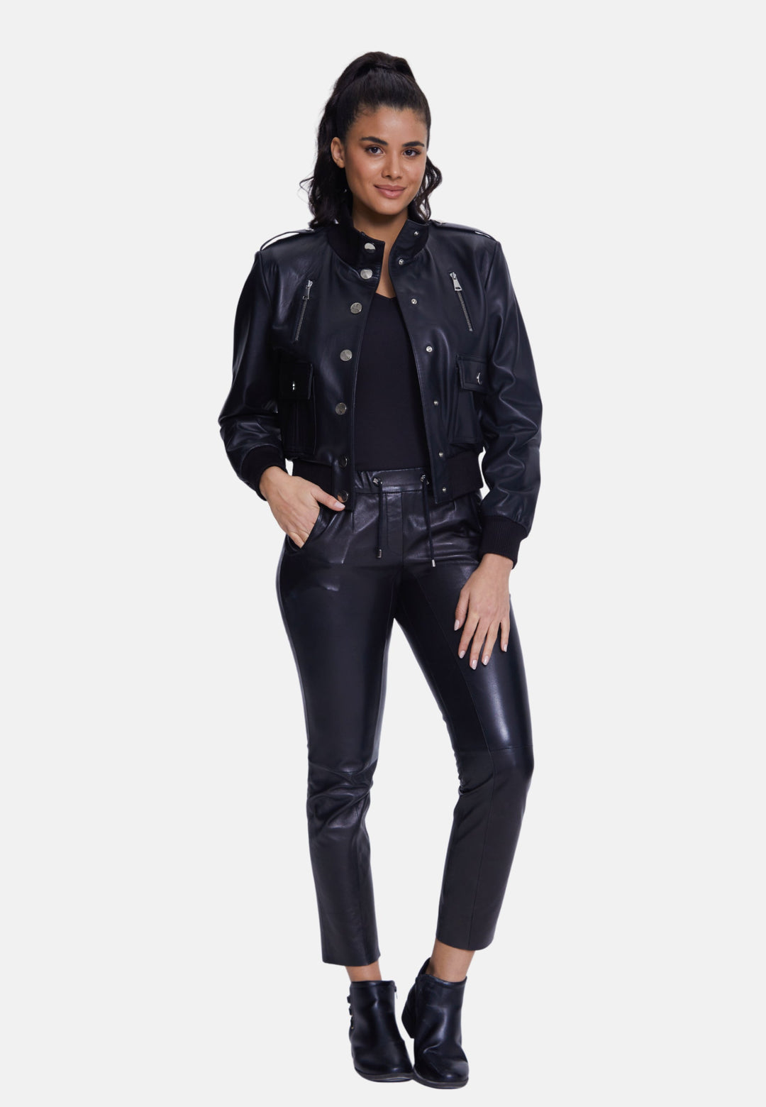Woman wearing black leather-look bomber outfit