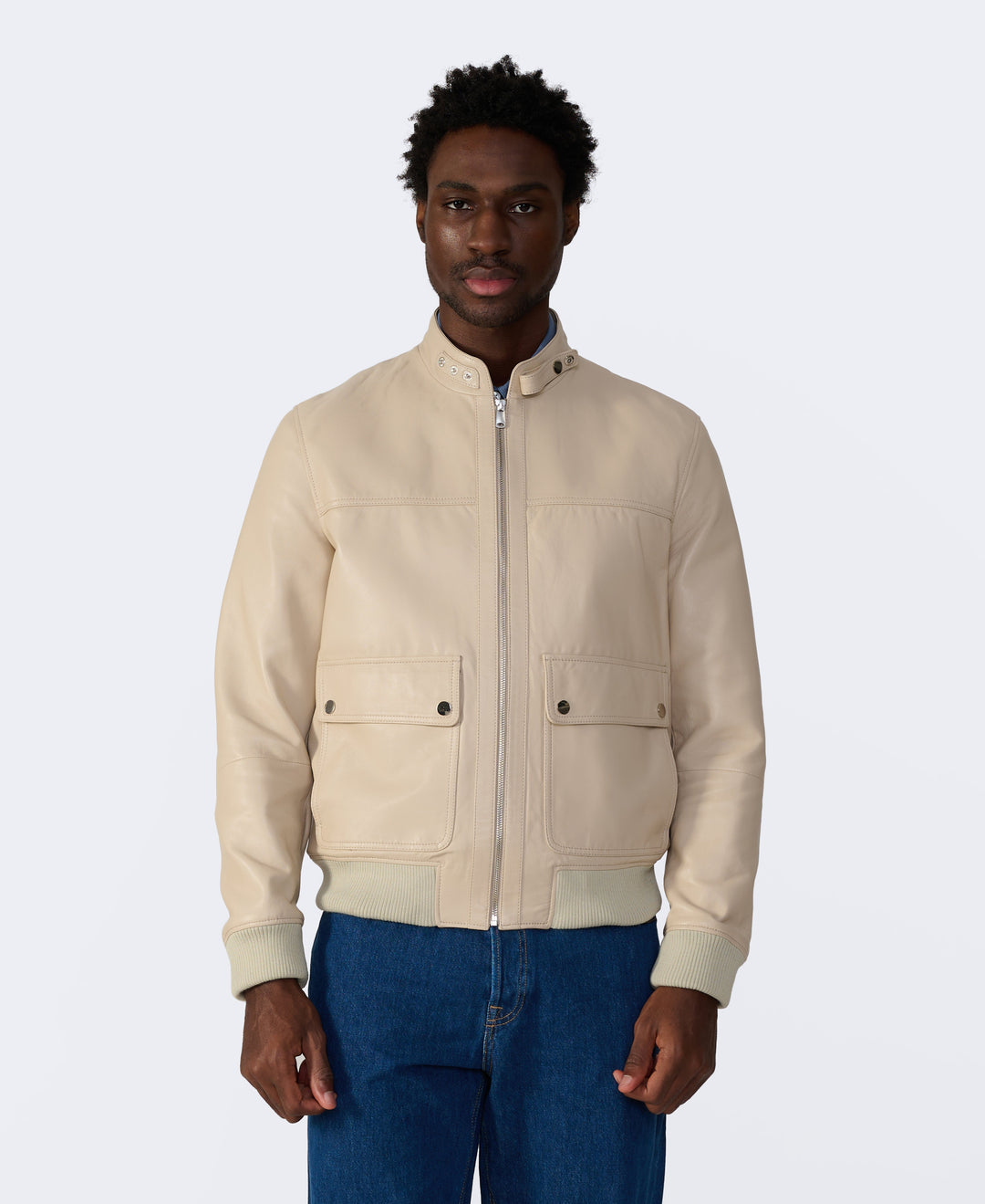 Beige leather bomber jacket on model