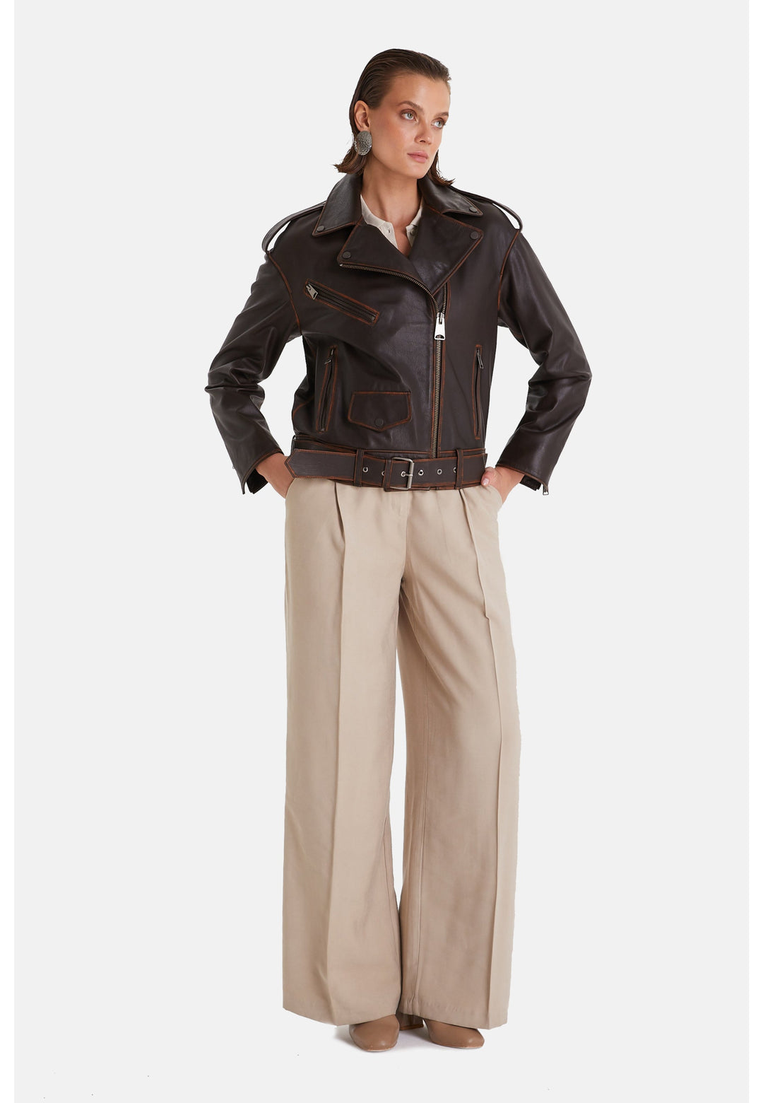 Woman wearing brown leather biker jacket