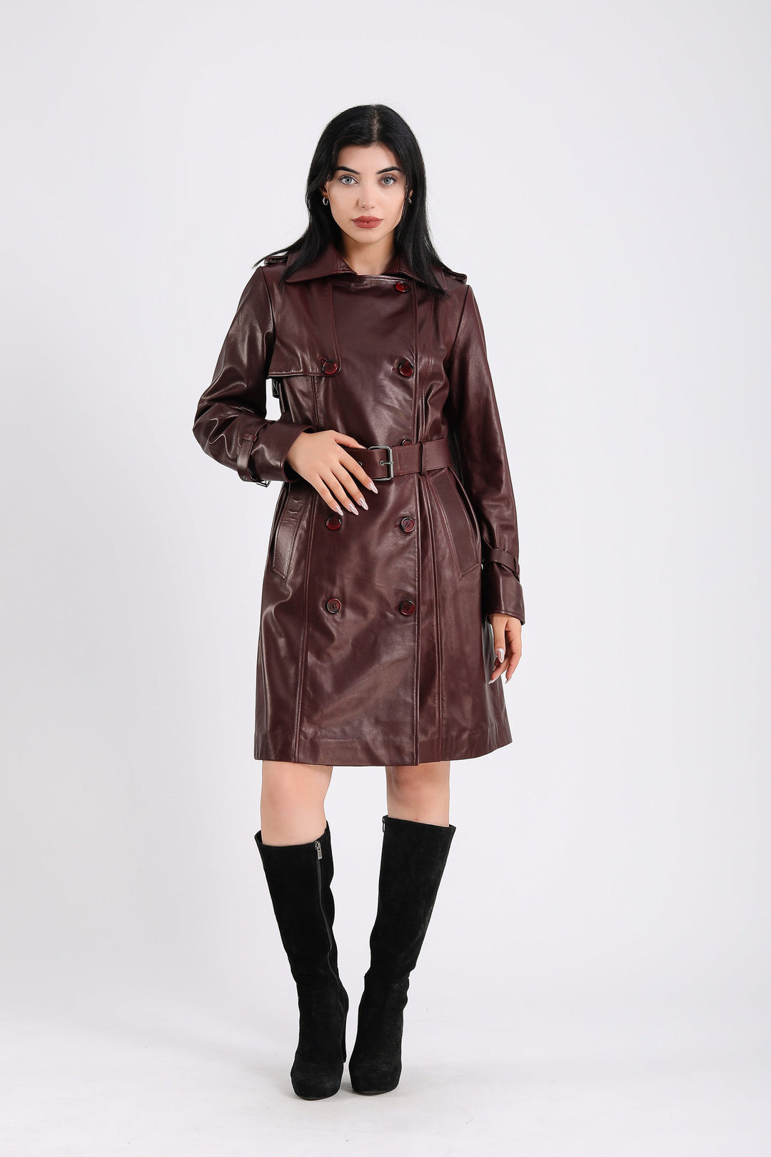Woman wearing brown leather trench coat