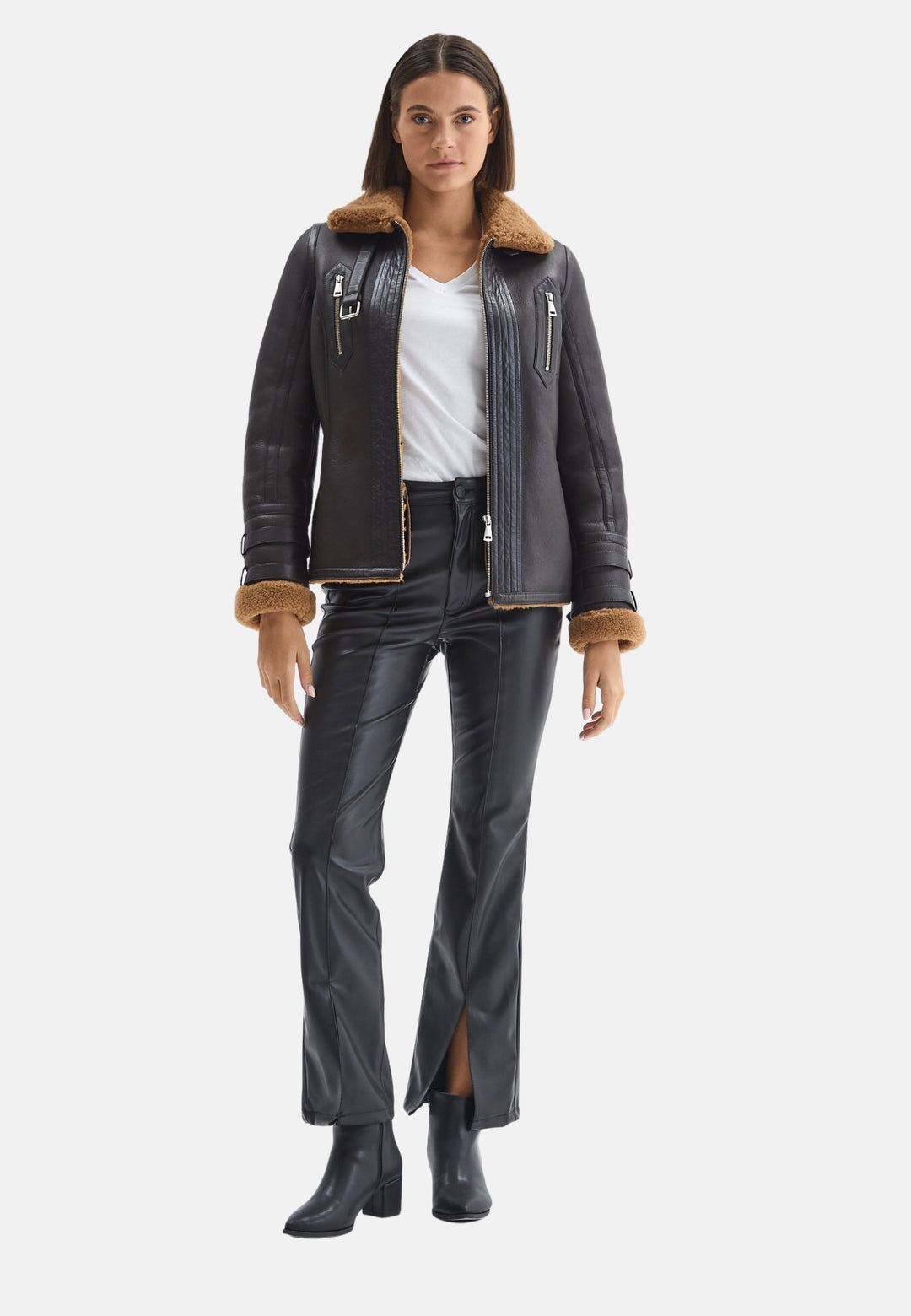 Woman wearing black shearling jacket