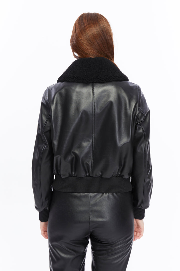 Rear view black leather bomber jacket on model
