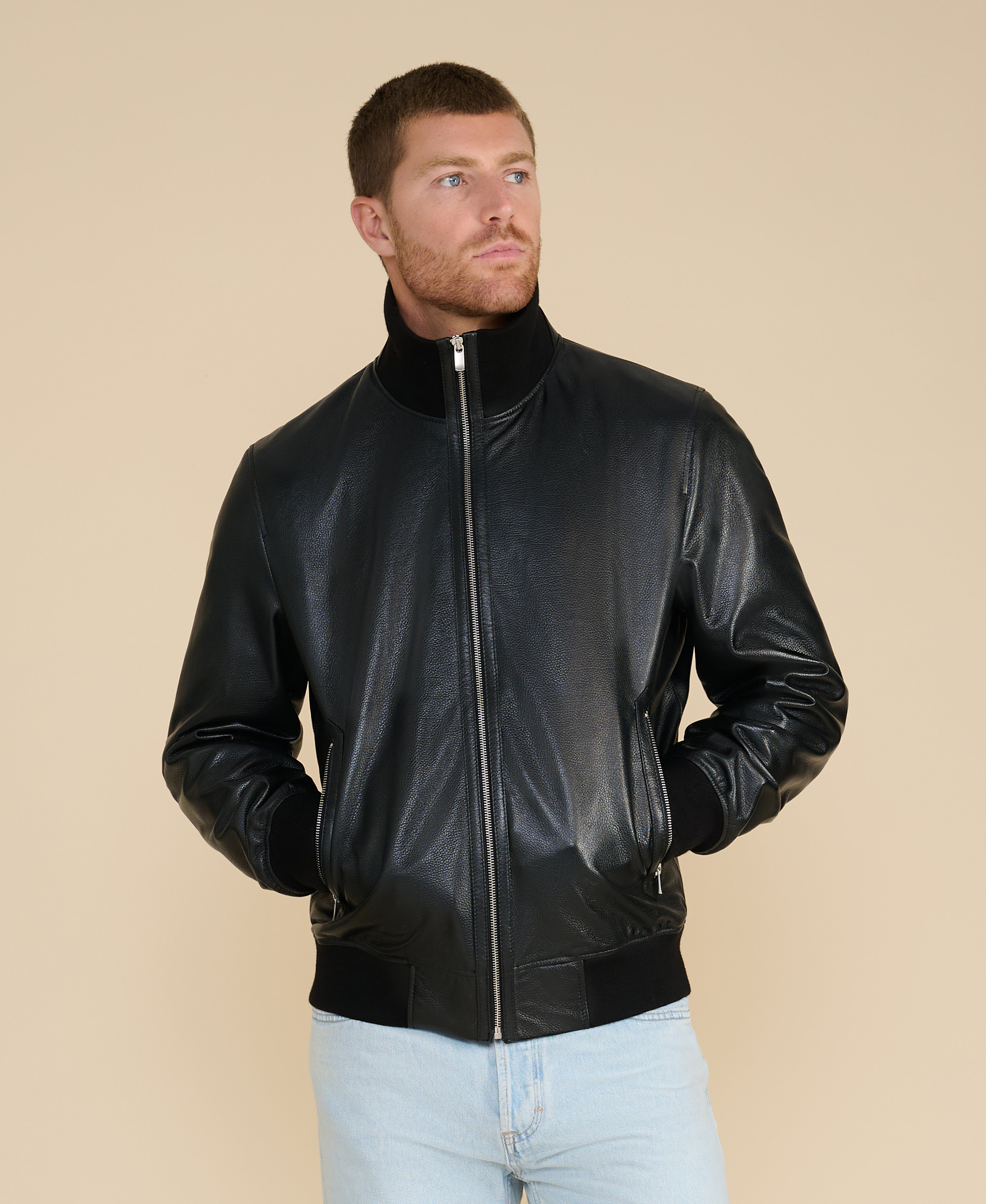 Man wearing black leather bomber jacket