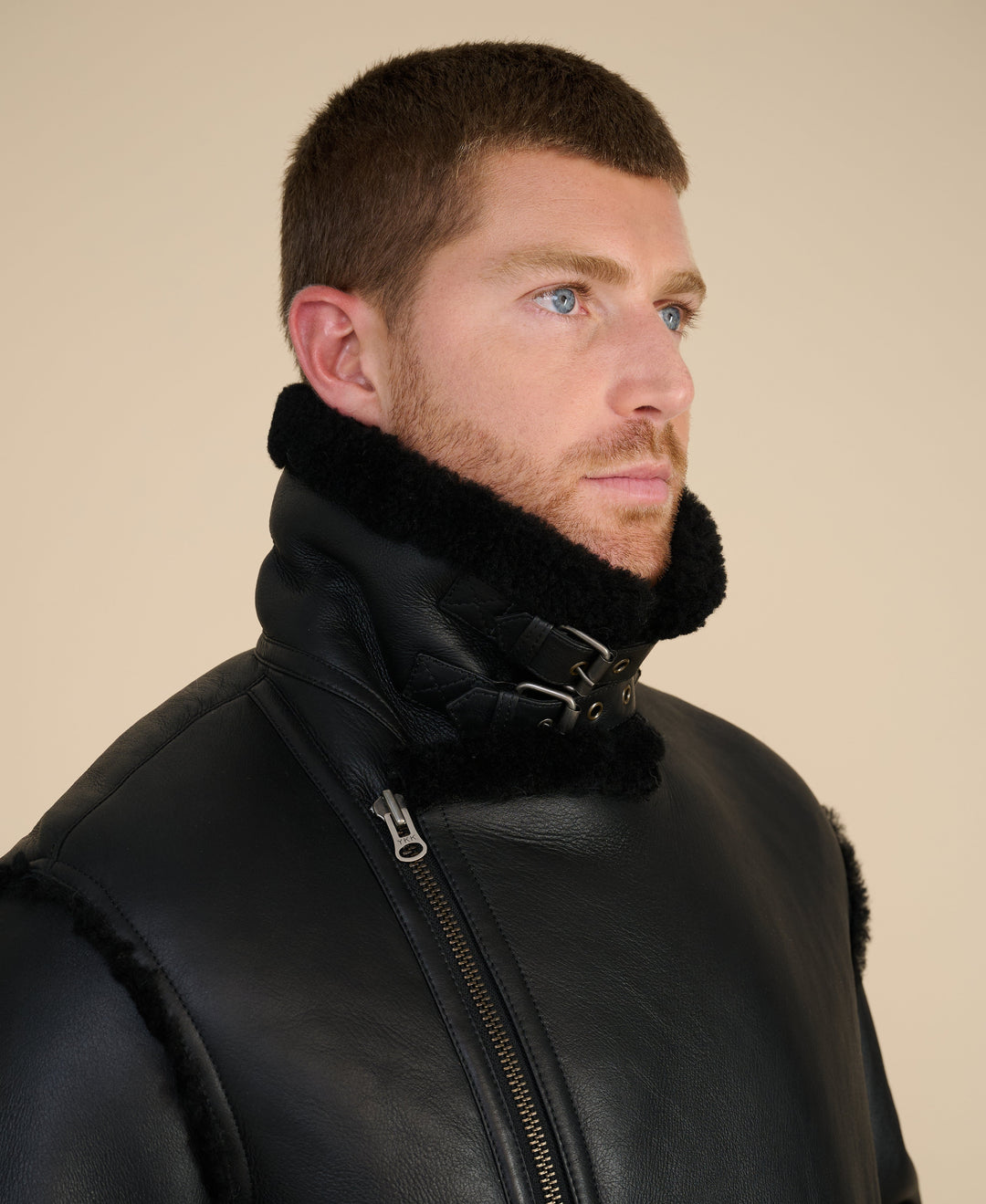Man wearing black shearling jacket