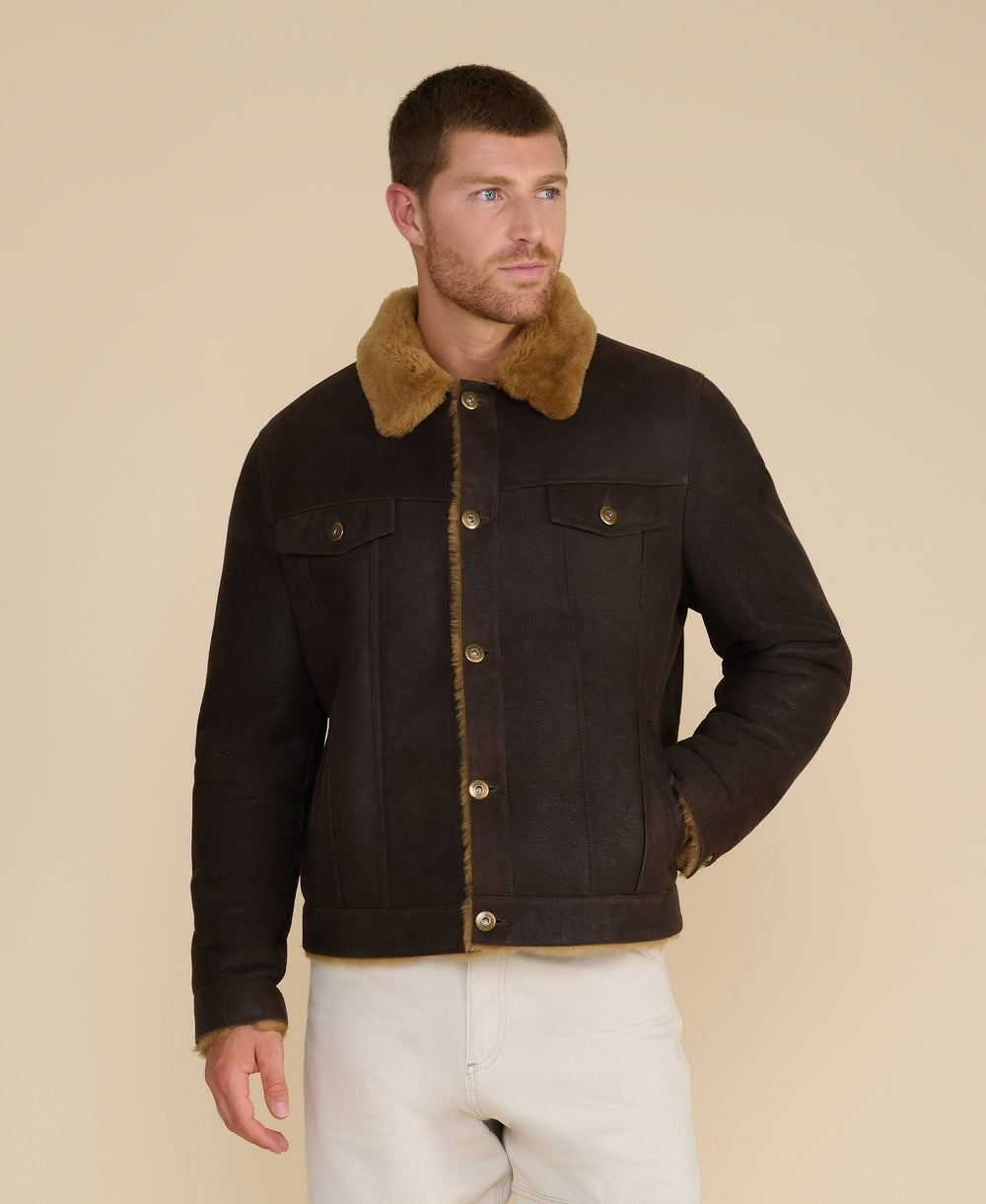 Man wearing brown shearling jacket