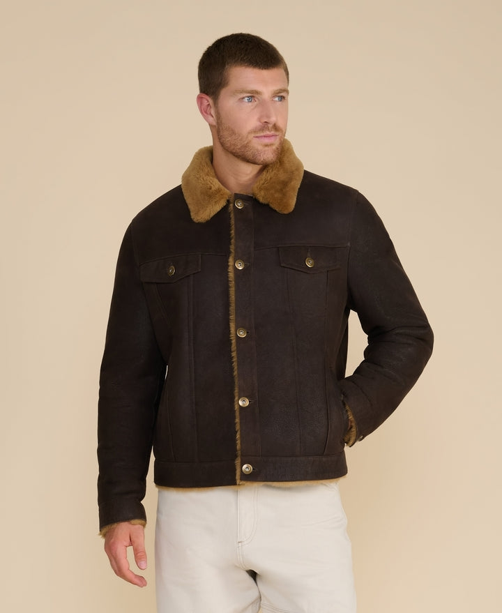Man wearing brown shearling jacket