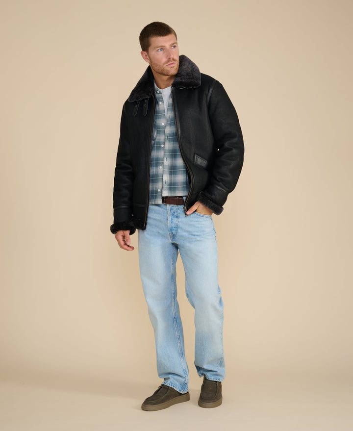 Man wearing black sheepskin aviator jacket