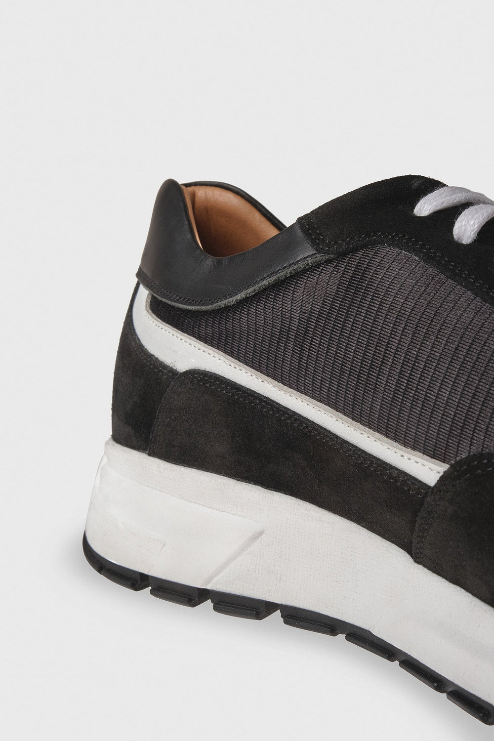 Black suede men's sneaker side view