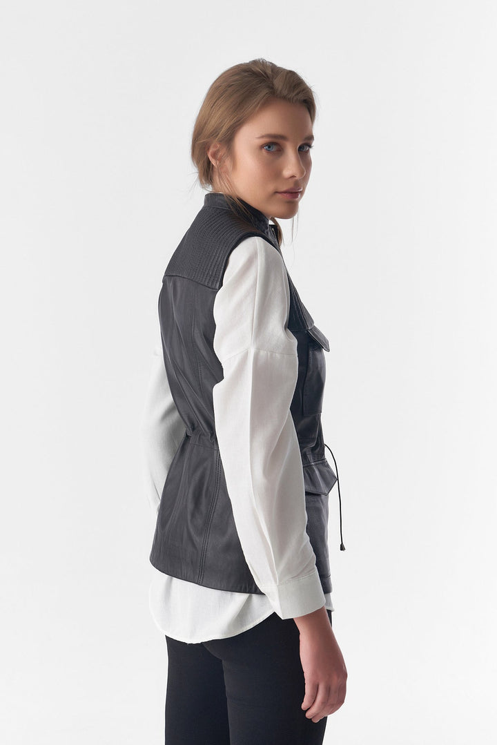 Black leather sleeveless vest on model