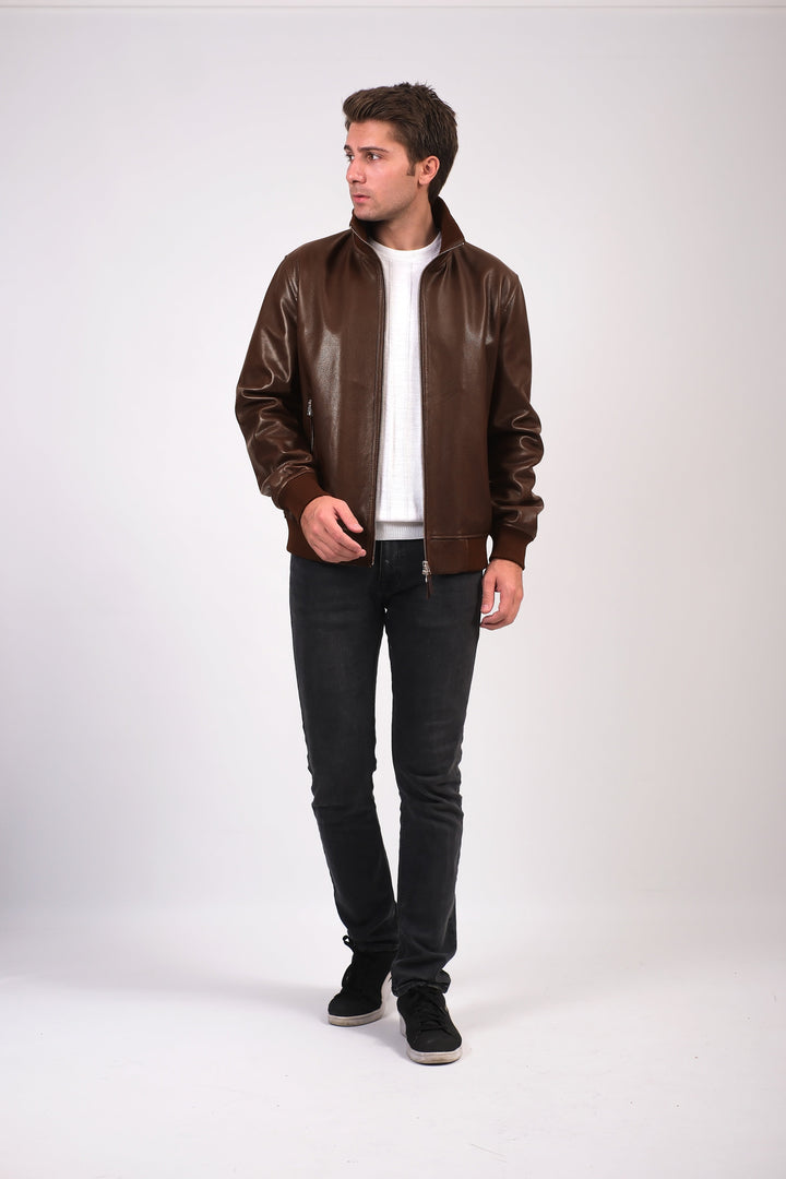 Man wearing brown leather jacket