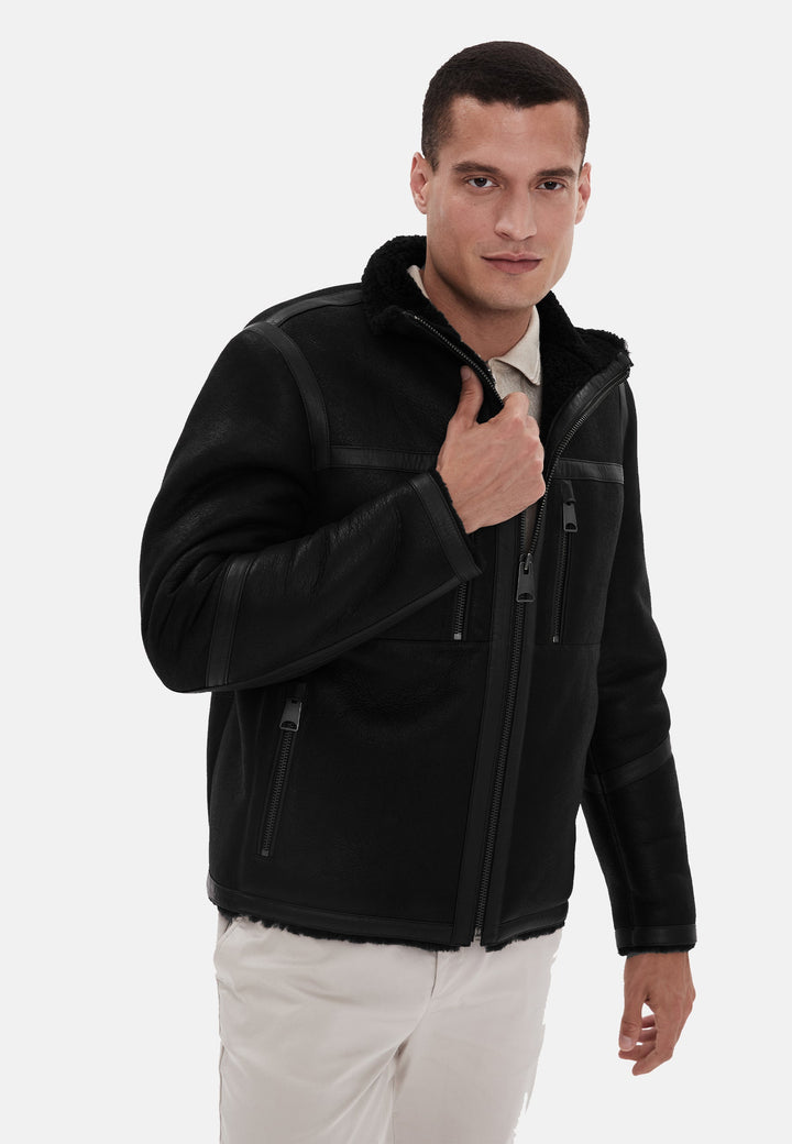 Man modelling black shearling leather jacket