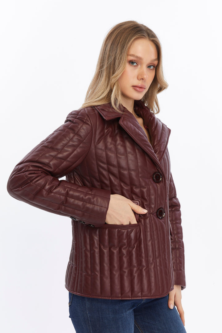 Woman wearing burgundy quilted leather coat