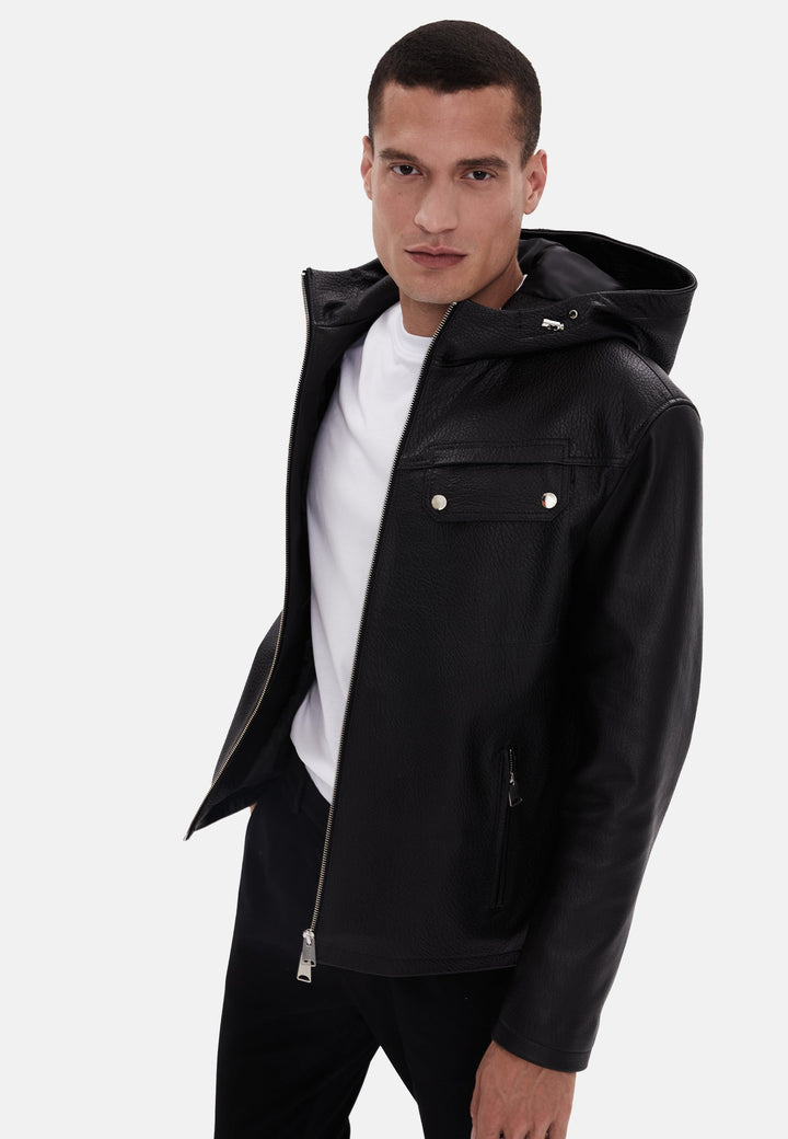 Man in black leather hooded jacket
