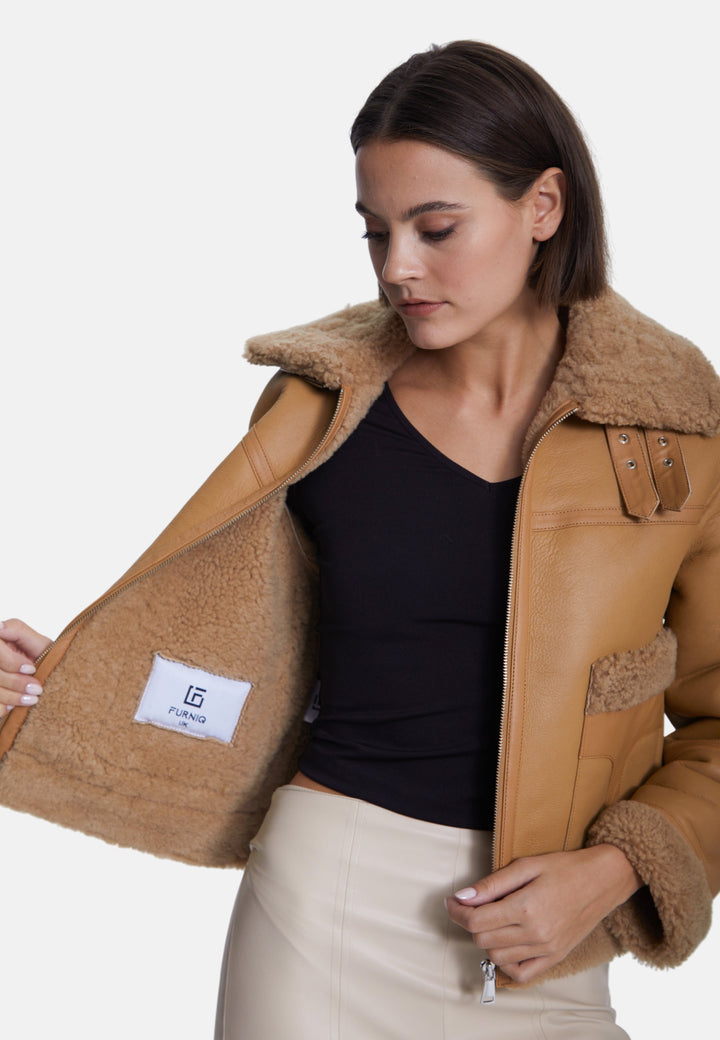 Woman wearing beige sheepskin jacket