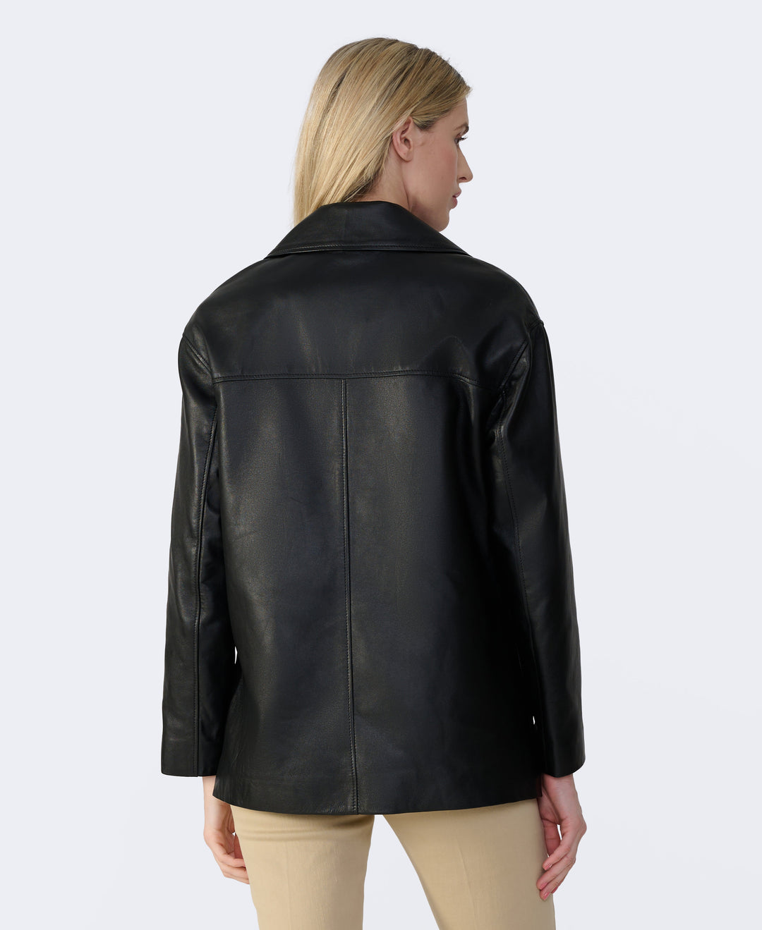 Woman wearing black leather jacket (back)