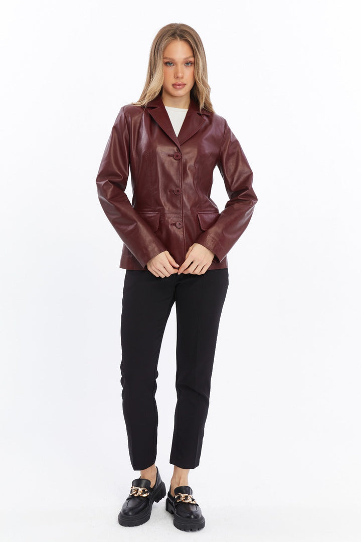 Woman wearing burgundy leather jacket