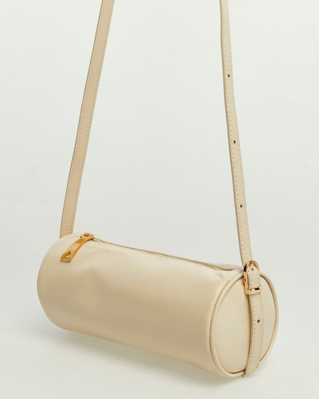 Beige cylindrical leather crossbody bag