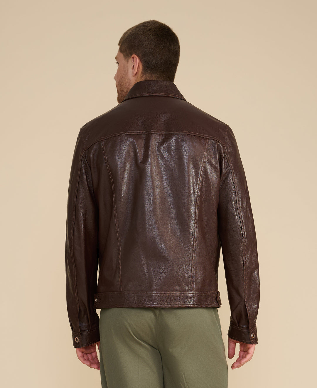 Brown leather jacket back view
