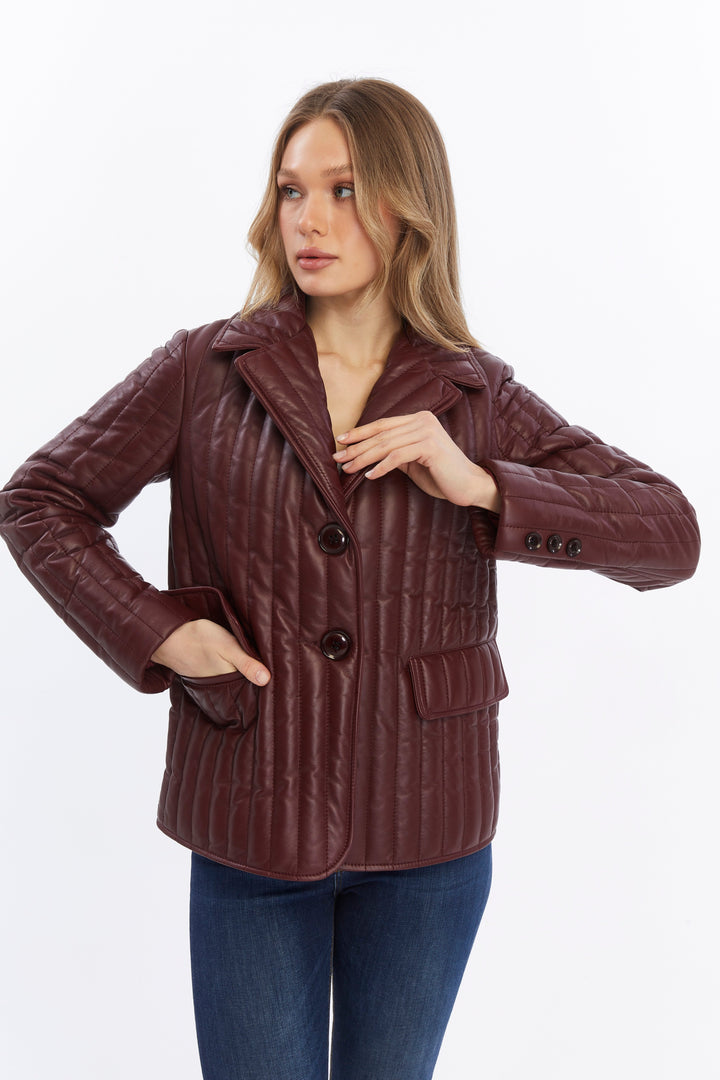Woman wearing burgundy quilted leather coat