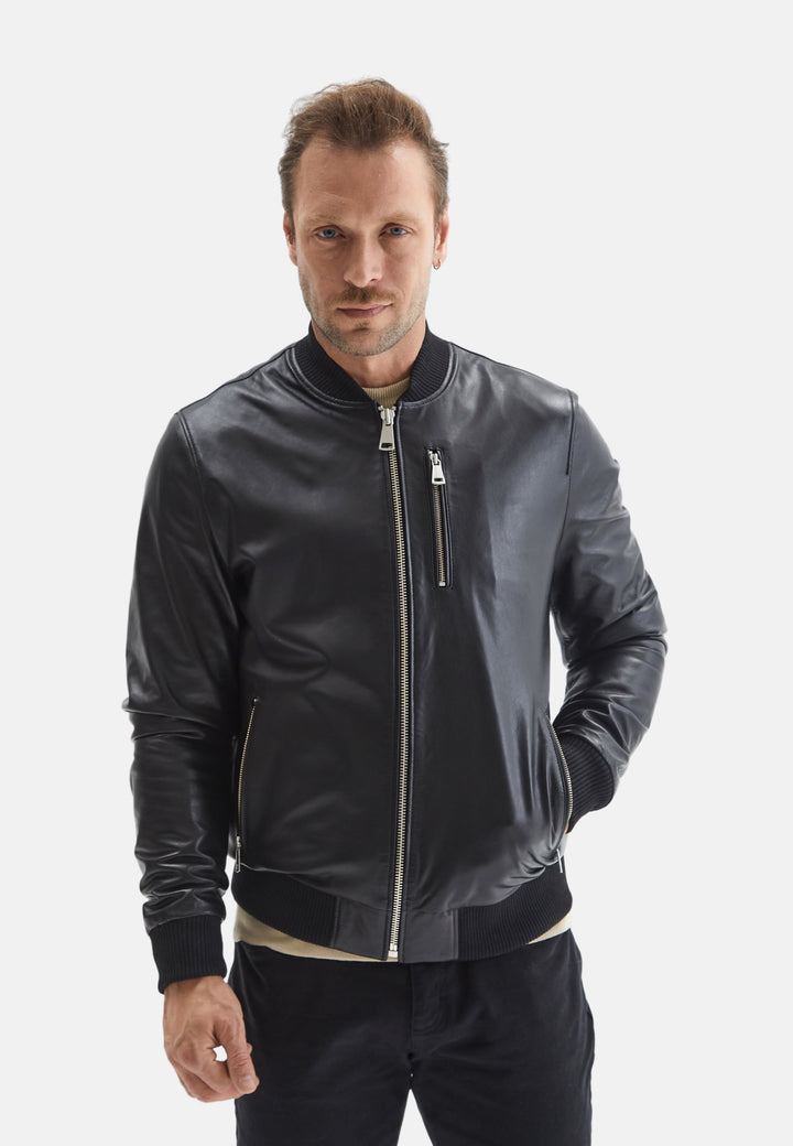 Male model wearing black leather bomber jacket