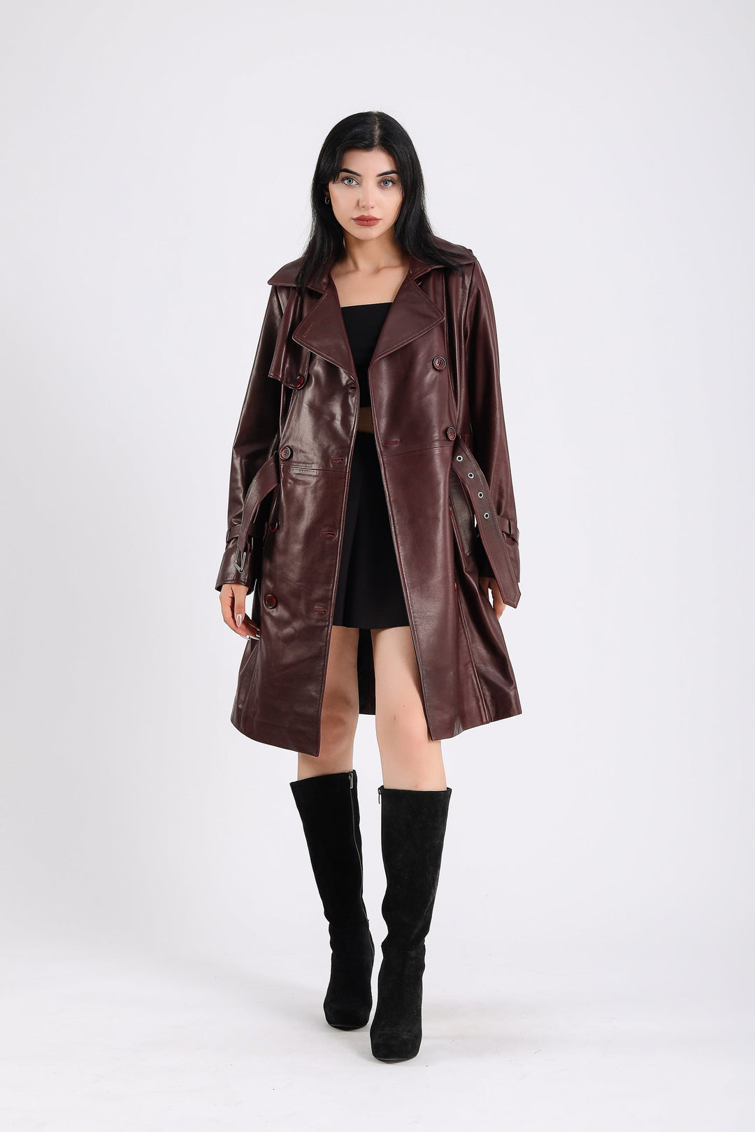 Woman wearing burgundy leather trench coat