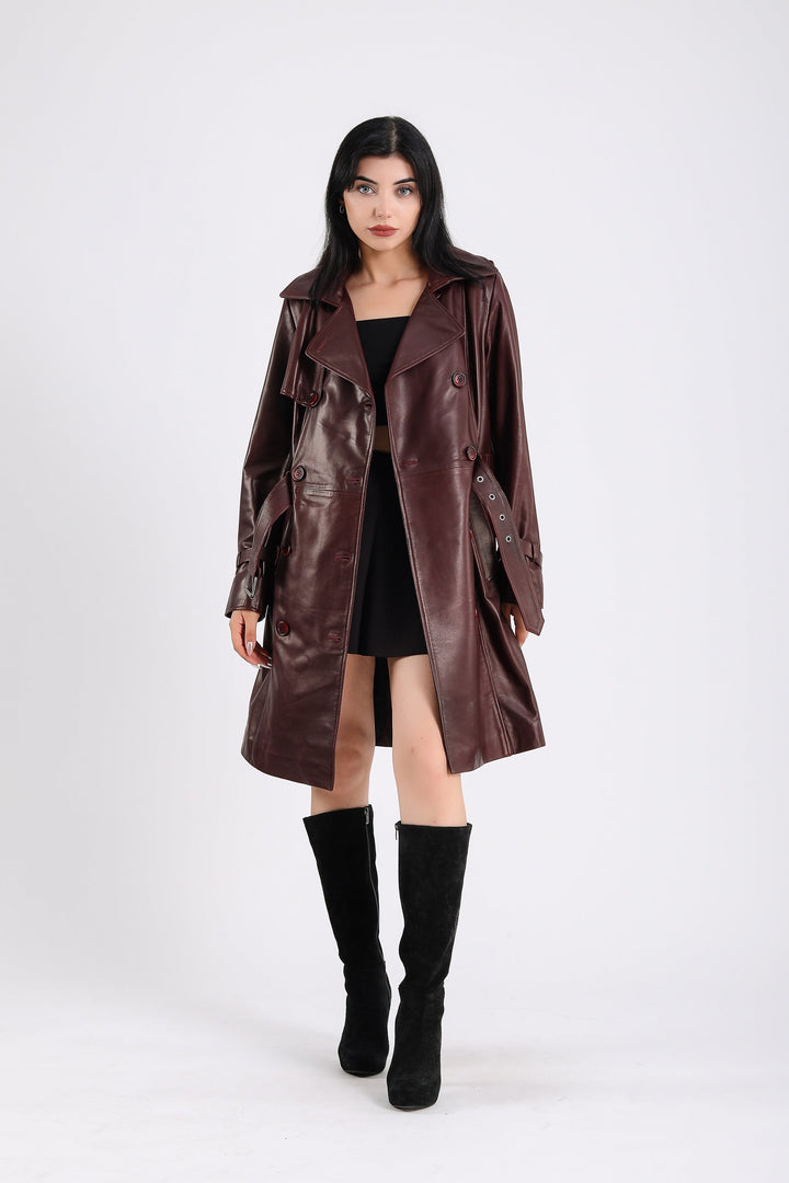 Woman wearing burgundy leather trench coat