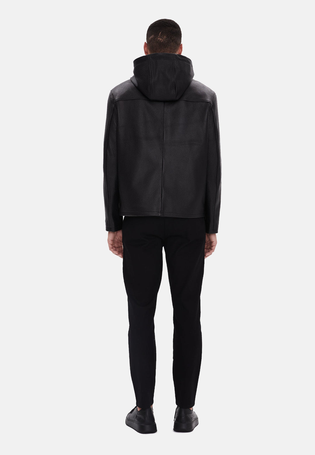 Man wearing black leather hooded jacket