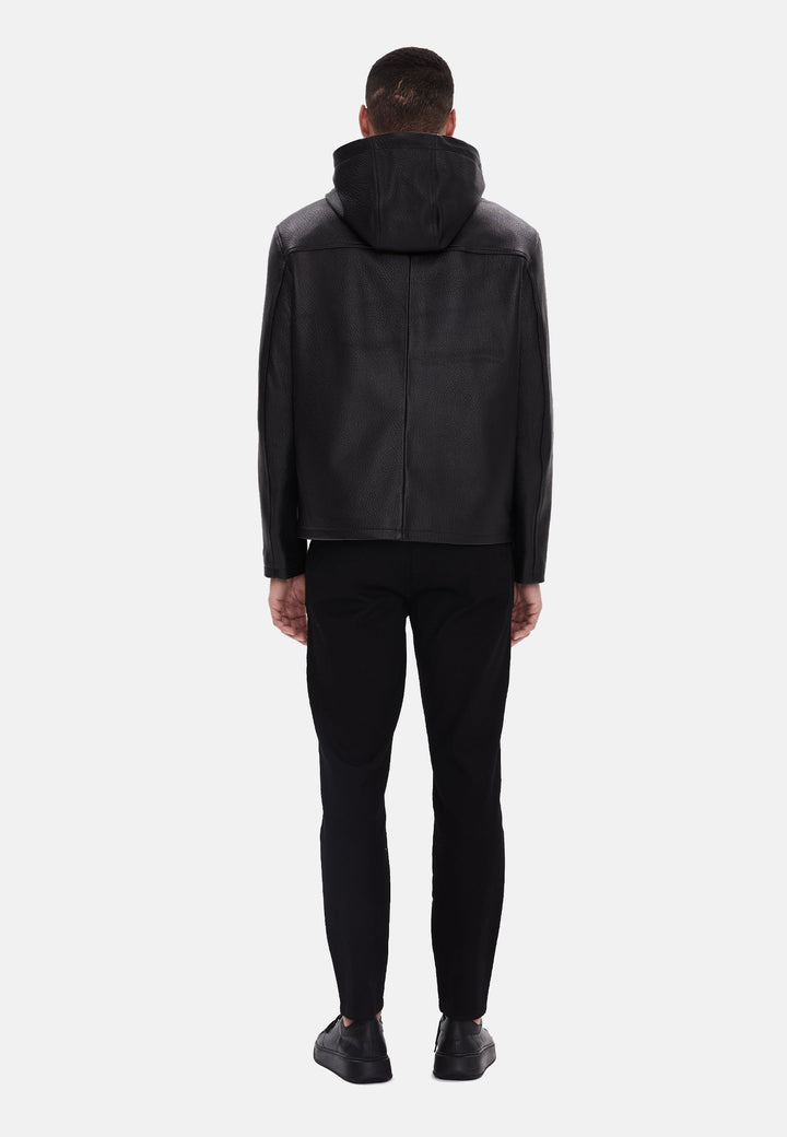 Man wearing black leather hooded jacket