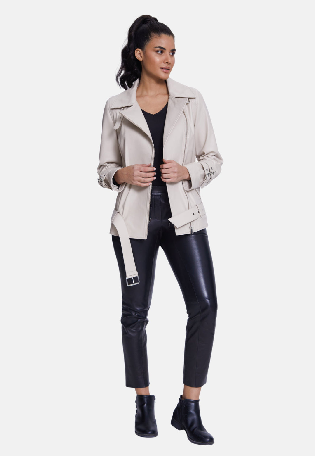 Woman wearing beige belted leather jacket