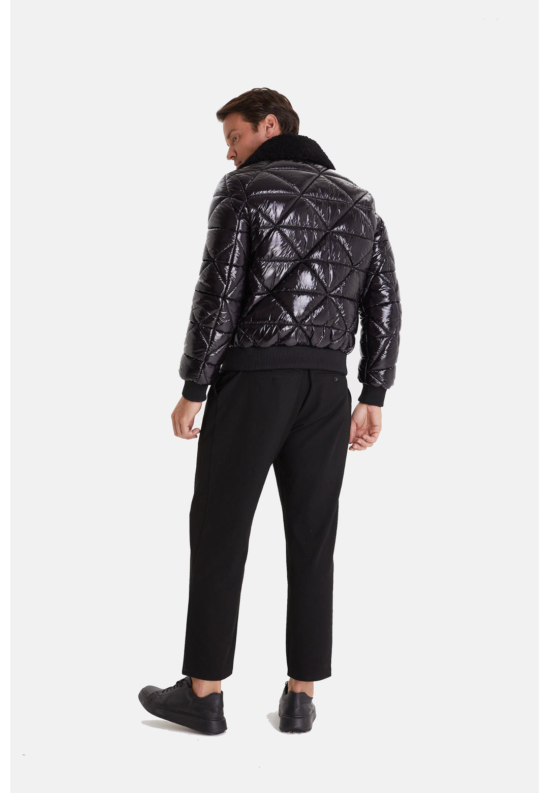 Man wearing black quilted leather jacket