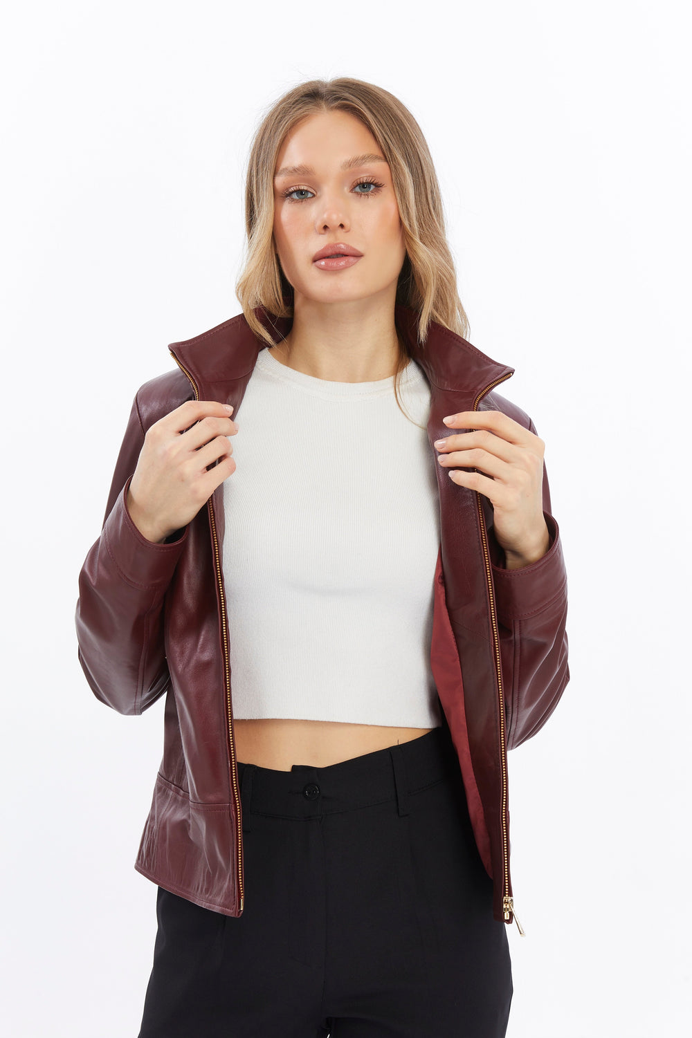 Woman wearing burgundy leather jacket