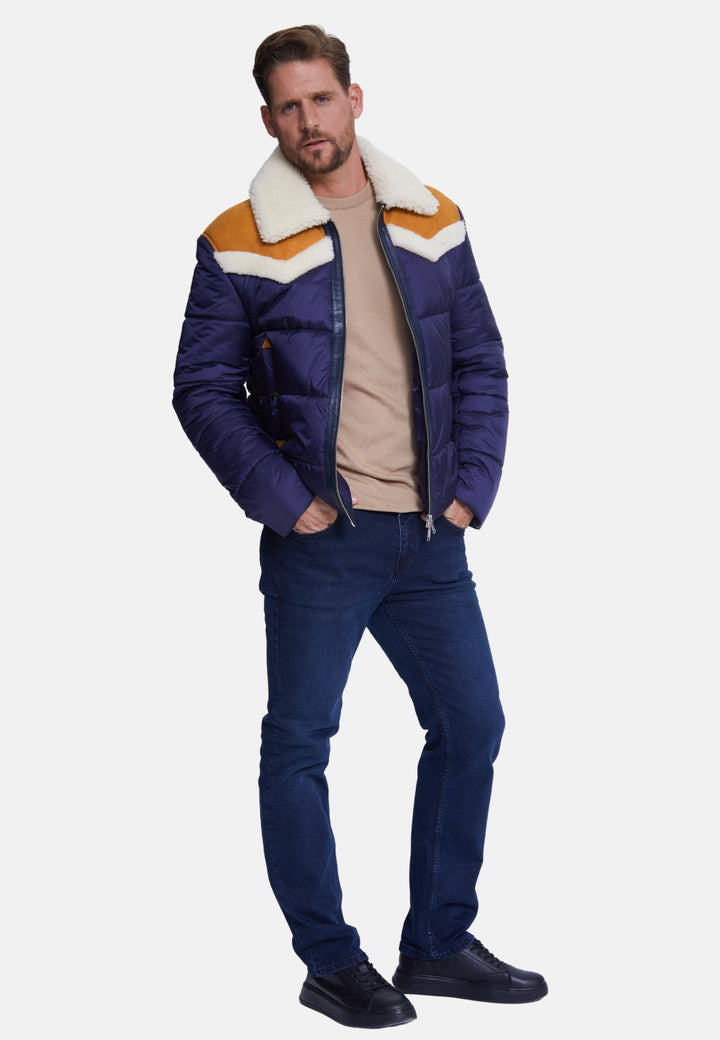 Man wearing navy chevron puffer coat