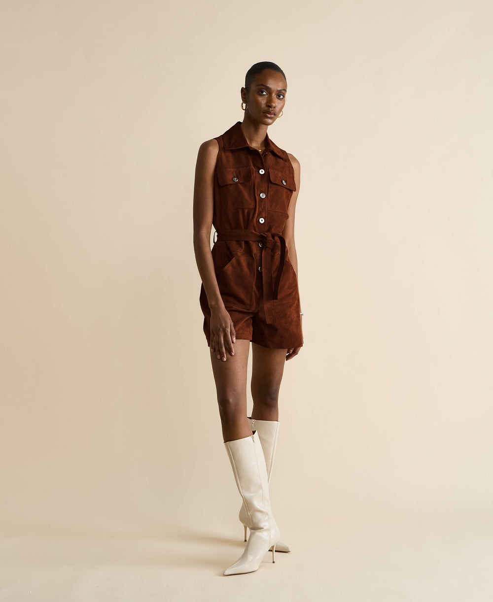Model wearing brown suede romper