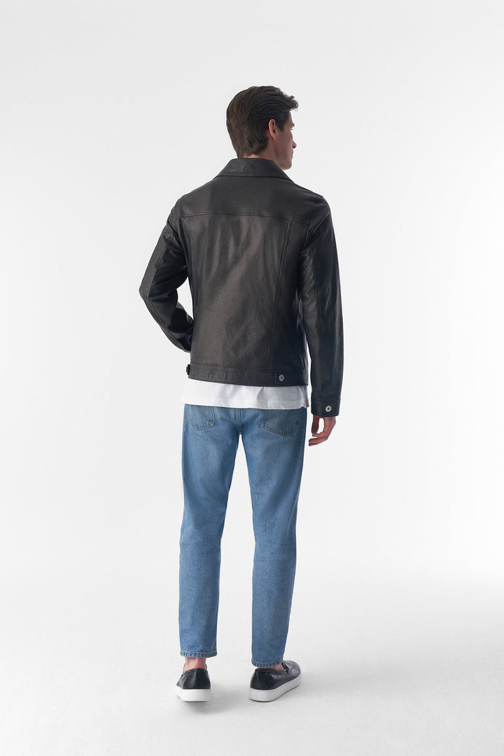 Man wearing black leather jacket - back view