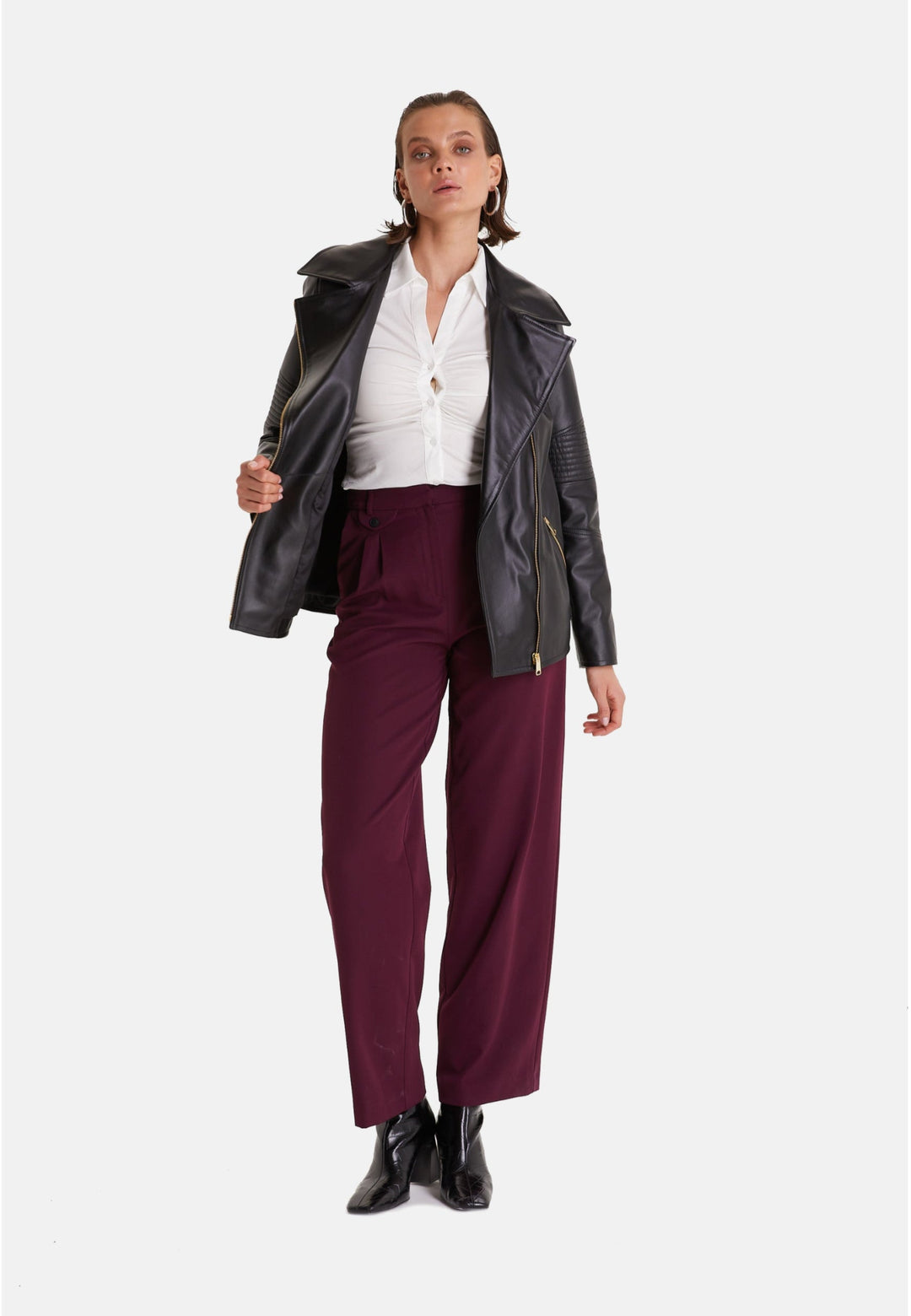 Woman wearing black leather biker jacket