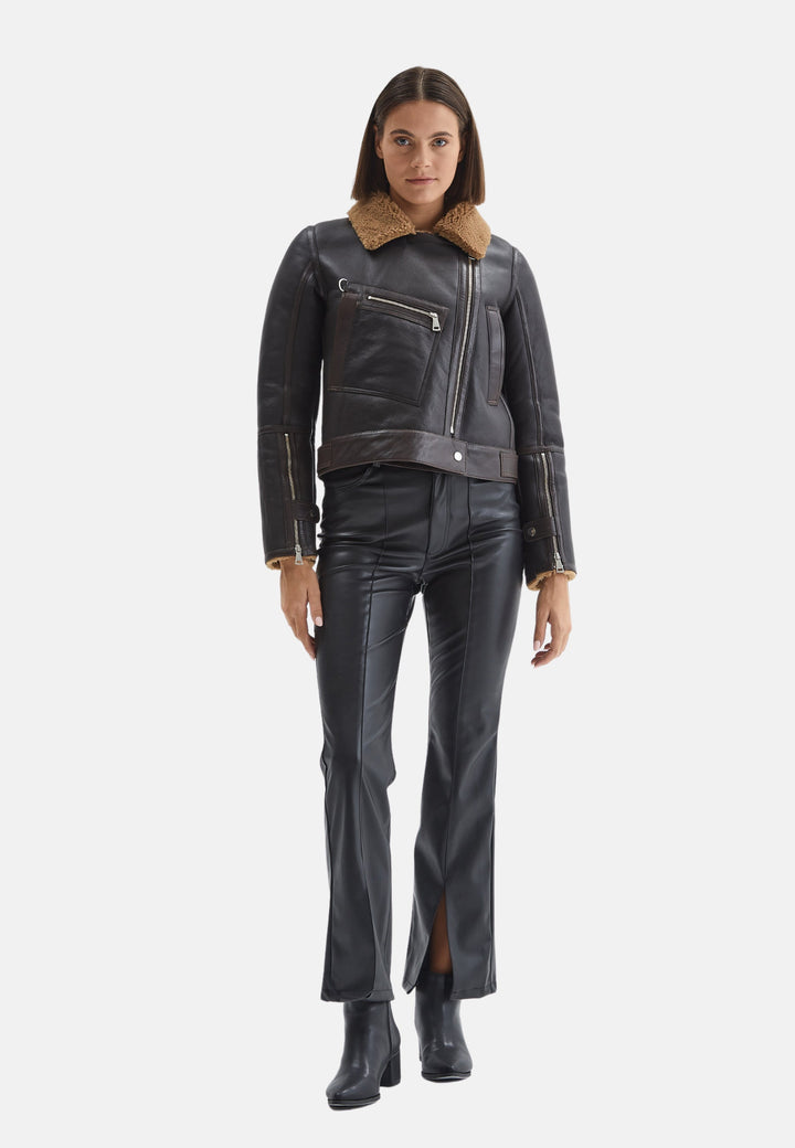 Woman wearing black sheepskin jacket