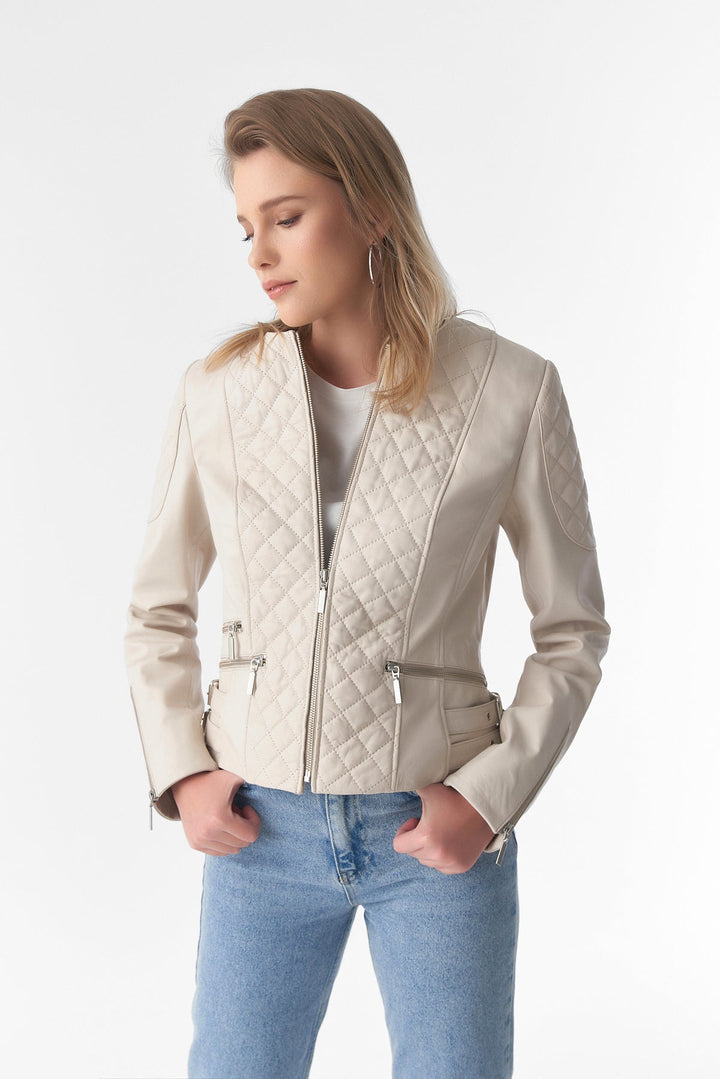 Woman wearing beige quilted leather jacket