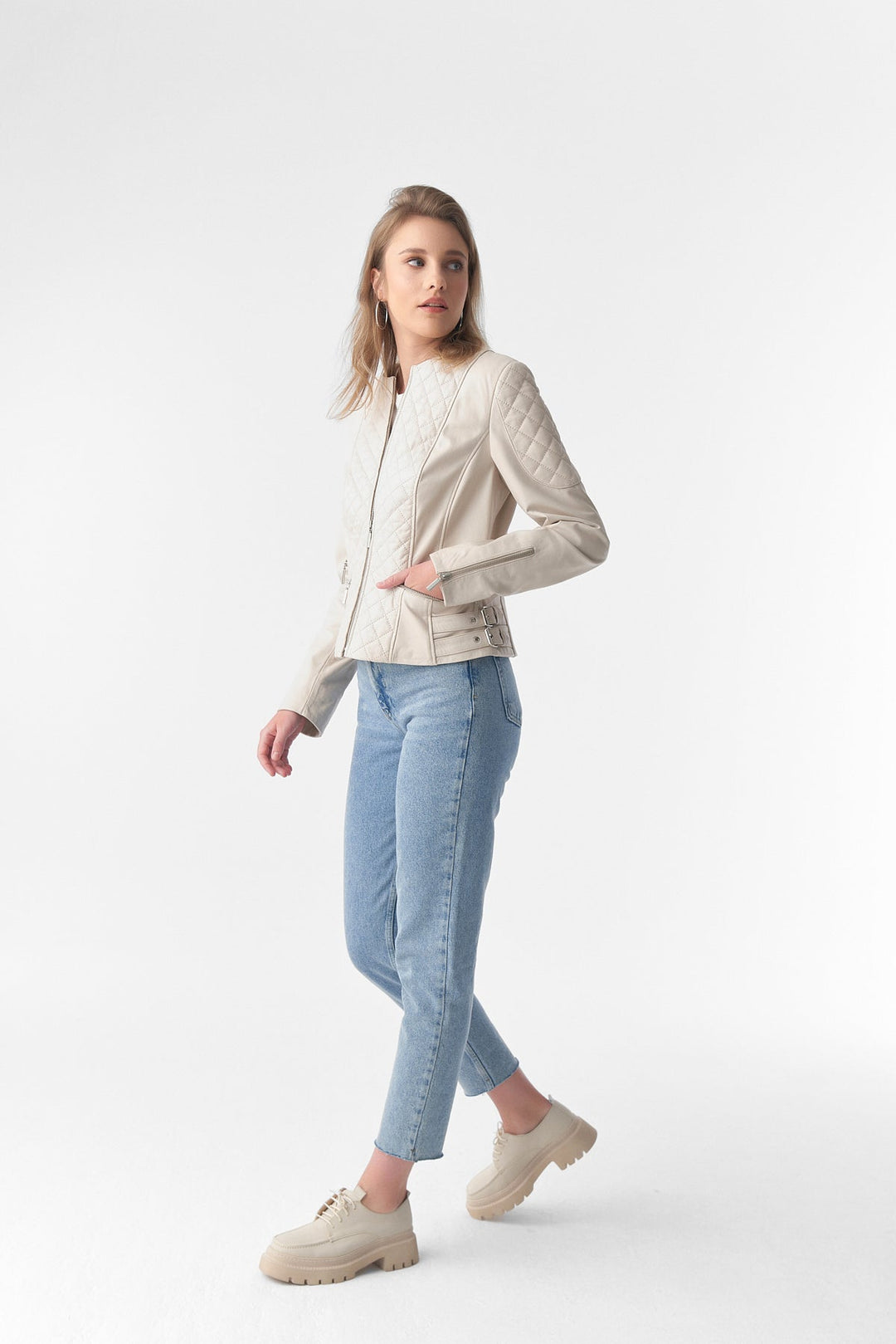 Woman wearing beige leather jacket