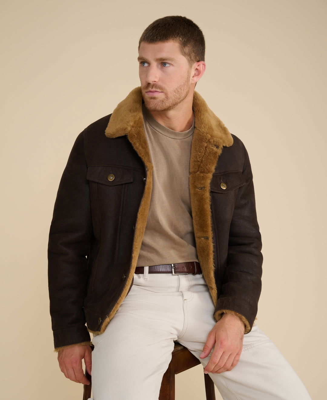 Man wearing brown shearling jacket