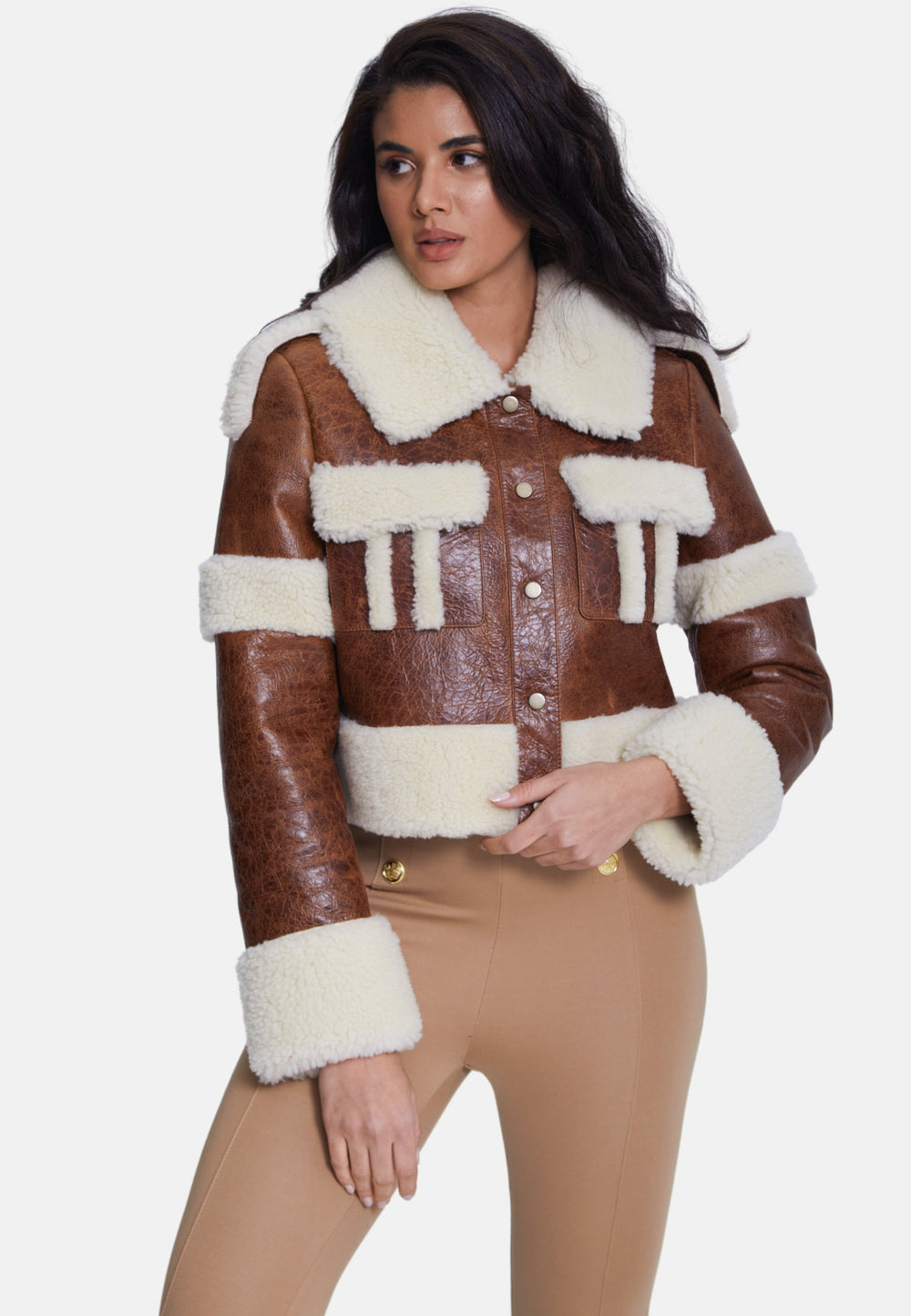 Woman wearing brown shearling jacket