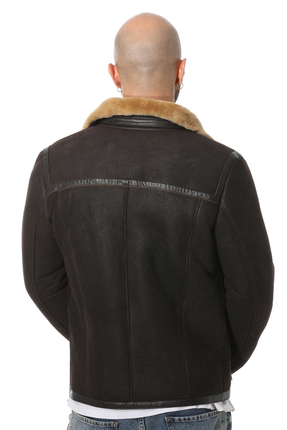 Bald man wearing brown shearling jacket back