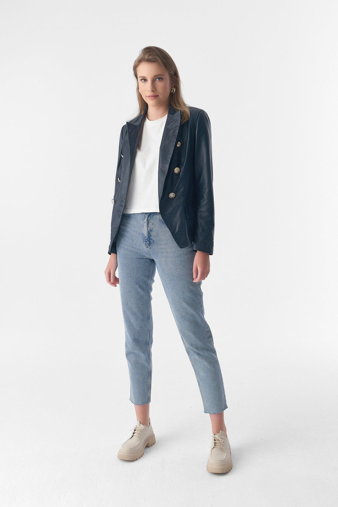 Woman wearing blue leather blazer