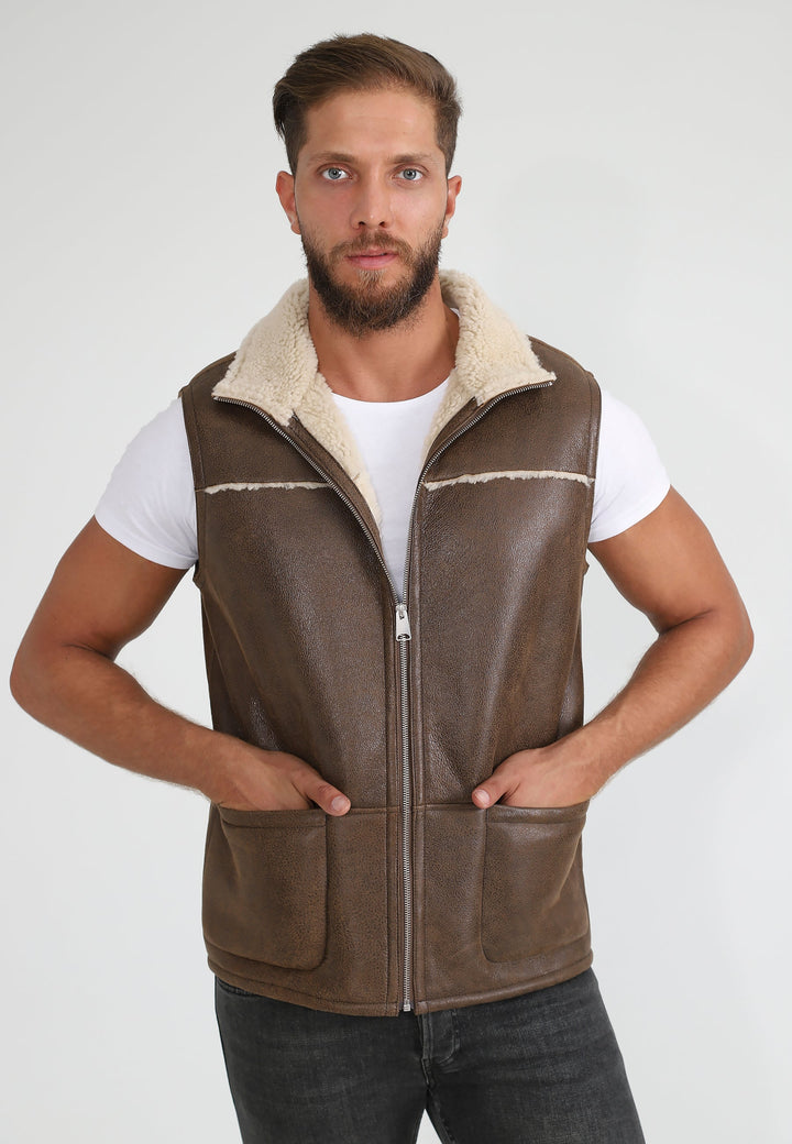 Bearded man wearing camel sheepskin waistcoat